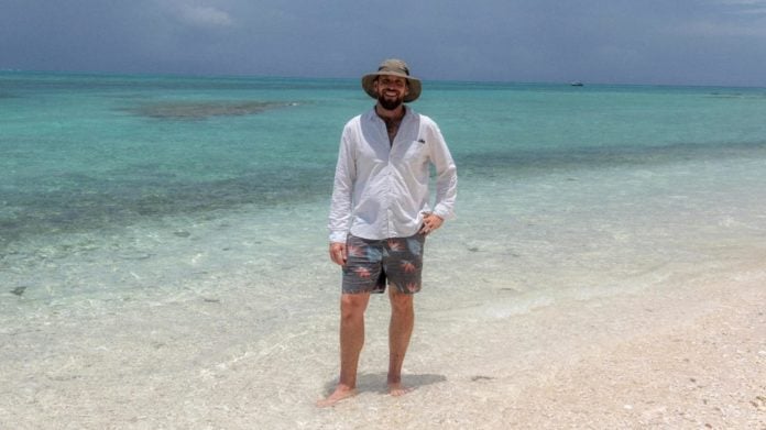 Guest presenter Paul West on the beach at Lady Musgrave Island (image - ABC)