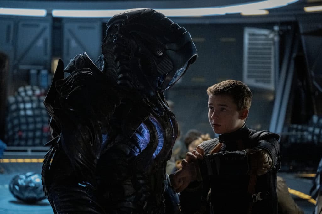 Brian Steele as Robot and Maxwell Jenkins as Will Robinson star in LOST IN SPACE (image - Diyah Pera/Netflix)