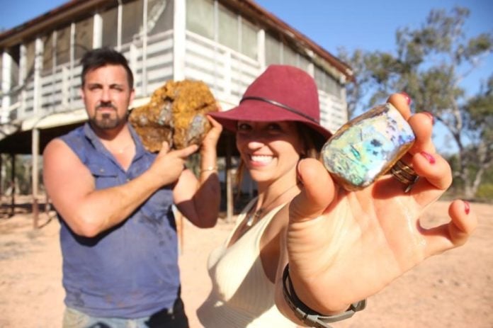 The Opal Whisperers Isaac and Sofia Andreou with their opal find Yowah QLD (image - Discovery)