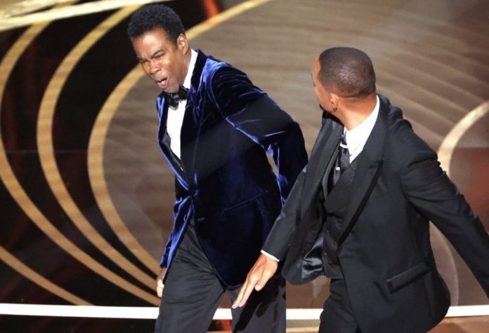 Will Smith hits Chris Rock following joke about Smith's wife, Jada Pinkett Smith, at the 94th Academy Awards (image - Myung Chun/The Los Angeles Times)