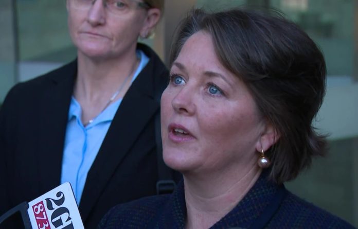 Sarah Monahan speaks directly after attending the parole hearing of convicted sex offender Robert Hughes (image - ABC News)