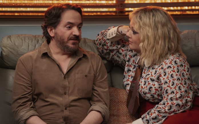 God’s Favorite Idiot. (L to R) Ben Falcone as Clark Thompson, Melissa McCarthy as Amily Luck (image - Netflix)