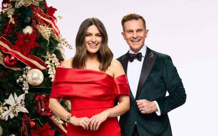 Sarah Abo joins David Campbell for the first time as co-host of Carols by Candlelight (image - Nine)