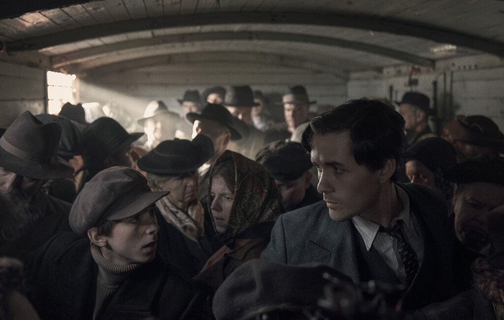 Jonah Hauer-King as Lali Sokolov, seen here as he boards the train to Auschwitz. (image - Stan)
